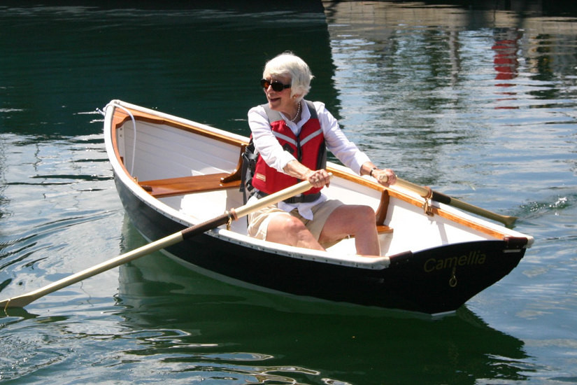 Mary rowing her Tadpole a Maine Whitehall